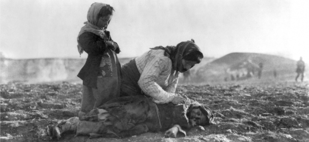 armenian_woman_kneeling_beside_dead_child_in_field